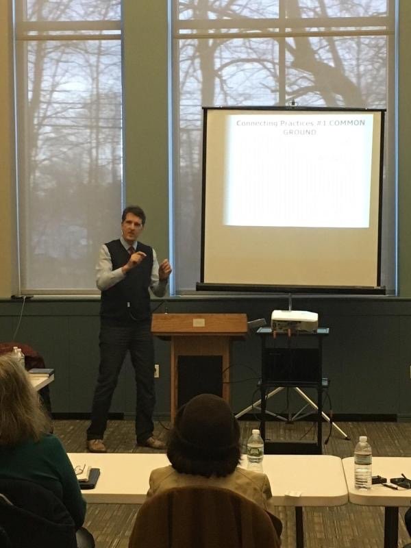 Speaking to audience at seminar